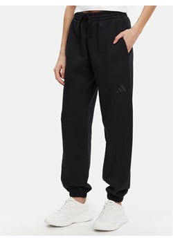 adidas Spodnie dresowe ALL SZN Fleece IW1024 Czarny Loose Fit ze sklepu MODIVO w kategorii Spodnie damskie - zdjęcie 181074426