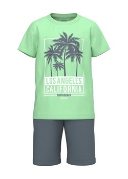 NAME IT Komplet t-shirt i spodenki 13214392 Zielony Regular Fit - id: 0000301999713 - marki Name It - 181075107 NAME IT Komplet t-shirt i spodenki 13214392 Zielony Regular Fit ze sklepu MODIVO w kategorii Komplety chłopięce - zdjęcie 181075107