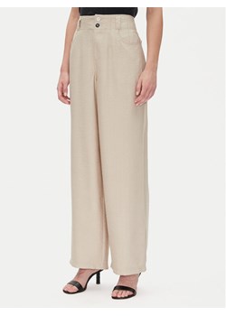 DKNY Spodnie materiałowe P41KTR48 Beżowy Loose Fit ze sklepu MODIVO w kategorii Spodnie damskie - zdjęcie 181076186