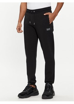 EA7 Emporio Armani Spodnie dresowe 3DPP77 PJUEZ 1200 Czarny Regular Fit ze sklepu MODIVO w kategorii Spodnie męskie - zdjęcie 181076937