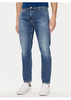 Tommy Jeans Jeansy DM0DM18765 Niebieski Tapered Fit ze sklepu MODIVO w kategorii Jeansy męskie - zdjęcie 181077627