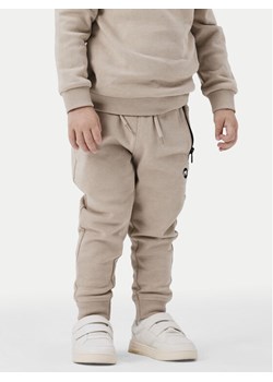 NAME IT Spodnie dresowe 13220380 Beżowy Regular Fit ze sklepu MODIVO w kategorii Spodnie chłopięce - zdjęcie 181078539