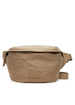 Calvin Klein Jeans Saszetka nerka Metro Oversized Waistbag Ny LV04G3088G Beżowy ze sklepu MODIVO w kategorii Nerki - zdjęcie 181079226
