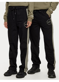 Ellesse Spodnie dresowe Unisex Nioro SHX21064 Czarny Regular Fit ze sklepu MODIVO w kategorii Spodnie męskie - zdjęcie 181081328