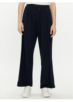 Tommy Hilfiger Spodnie dresowe UW0UW04771 Granatowy Relaxed Fit ze sklepu MODIVO w kategorii Spodnie damskie - zdjęcie 181083405
