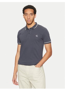 Calvin Klein Jeans Polo J30J315603 Granatowy Slim Fit ze sklepu MODIVO w kategorii T-shirty męskie - zdjęcie 181084535