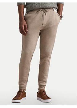 Polo Ralph Lauren Spodnie dresowe 710881518046 Beżowy Regular Fit ze sklepu MODIVO w kategorii Spodnie męskie - zdjęcie 181085269