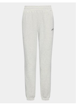 Athlecia Spodnie dresowe Studio W Pants EA231372 Biały Regular Fit ze sklepu MODIVO w kategorii Spodnie męskie - zdjęcie 181086067