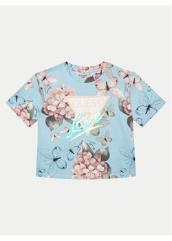 Guess T-Shirt J5RI05 K6YW4 Błękitny Boxy Fit ze sklepu MODIVO w kategorii Bluzki dziewczęce - zdjęcie 181087507
