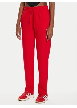 adidas Spodnie dresowe Essentials Small Logo IY1634 Czerwony Regular Fit ze sklepu MODIVO w kategorii Spodnie damskie - zdjęcie 181088975