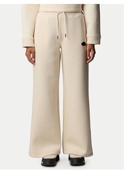 The North Face Spodnie dresowe NF0A8C25 Beżowy Wide Leg ze sklepu MODIVO w kategorii Spodnie damskie - zdjęcie 181089376