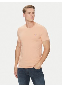 Guess T-Shirt M2YI24 J1314 Pomarańczowy Slim Fit ze sklepu MODIVO w kategorii T-shirty męskie - zdjęcie 181091266
