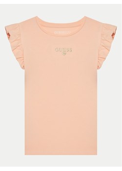 Guess T-Shirt K5RI26 K6YW4 Koralowy Regular Fit ze sklepu MODIVO w kategorii Bluzki dziewczęce - zdjęcie 181094615
