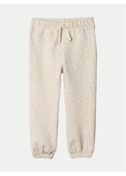Gap Spodnie dresowe 635490 Écru Regular Fit ze sklepu MODIVO w kategorii Spodnie dziewczęce - zdjęcie 181096158