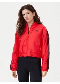 adidas Kurtka bomber Essentials 3-Stripes JP1724 Czerwony Loose Fit ze sklepu MODIVO w kategorii Kurtki damskie - zdjęcie 181096356