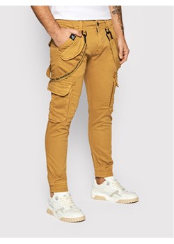 Alpha Industries Spodnie materiałowe Utility 128202 Brązowy Slim Fit ze sklepu MODIVO w kategorii Spodnie męskie - zdjęcie 181104609