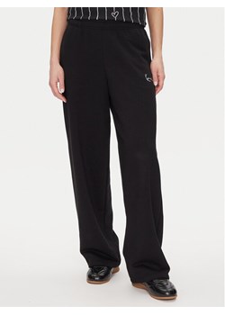Karl Kani Spodnie dresowe Signature Os 61030062 Czarny Relaxed Fit ze sklepu MODIVO w kategorii Spodnie damskie - zdjęcie 181106526