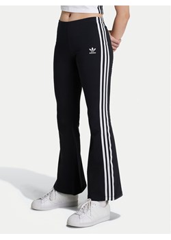 adidas Legginsy adicolor IY9785 Czarny Slim Fit ze sklepu MODIVO w kategorii Spodnie dziewczęce - zdjęcie 181109588