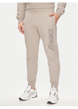 Asics Spodnie dresowe Logo 2031E189 Szary Regular Fit ze sklepu MODIVO w kategorii Spodnie męskie - zdjęcie 181111286