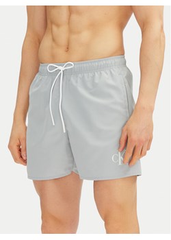 Calvin Klein Swimwear Szorty kąpielowe KM0KM01101 Niebieski Regular Fit ze sklepu MODIVO w kategorii Kąpielówki - zdjęcie 181111547