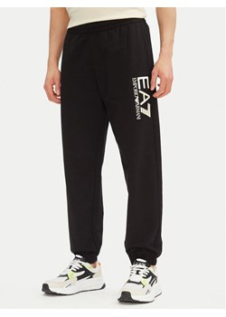 EA7 Emporio Armani Spodnie dresowe 7M000233 AF13512 MC156 Czarny Regular Fit ze sklepu MODIVO w kategorii Spodnie męskie - zdjęcie 181113527