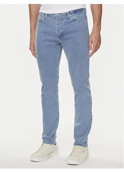 Tommy Jeans Jeansy Simon DM0DM18771 Niebieski Skinny Fit ze sklepu MODIVO w kategorii Jeansy męskie - zdjęcie 181118867