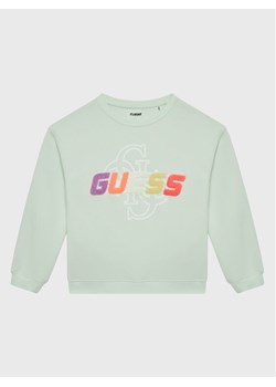 Guess Bluza J3GQ08 FL04P Zielony Regular Fit ze sklepu MODIVO w kategorii Bluzy dziewczęce - zdjęcie 181119985