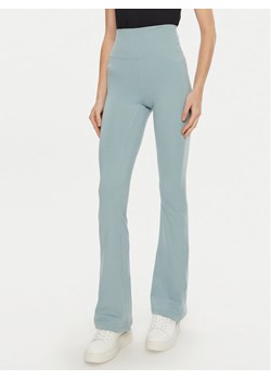Guess Spodnie materiałowe V4YB15 KCD02 Niebieski Flare Fit ze sklepu MODIVO w kategorii Spodnie damskie - zdjęcie 181120397