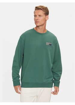 New Balance Bluza Athletics Premium Logo MT41547NUS Zielony Relaxed Fit ze sklepu MODIVO w kategorii Bluzy męskie - zdjęcie 181122765