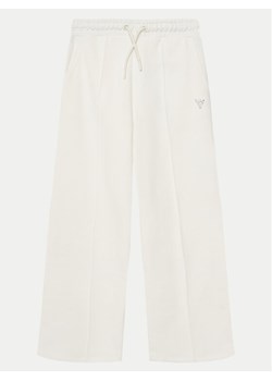 Guess Spodnie dresowe J5GQ11 KCRP0 Biały Relaxed Fit ze sklepu MODIVO w kategorii Spodnie dziewczęce - zdjęcie 181125046