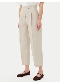 Tommy Hilfiger Spodnie materiałowe WW0WW45461 Beżowy Tapered Fit ze sklepu MODIVO w kategorii Spodnie damskie - zdjęcie 181127155