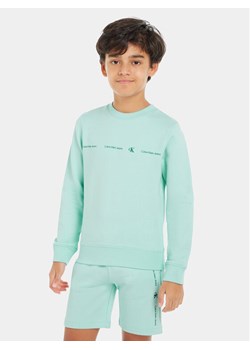Calvin Klein Jeans Bluza Minimalistic IB0IB02050 Niebieski Regular Fit ze sklepu MODIVO w kategorii Bluzy chłopięce - zdjęcie 181133068