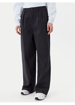 New Balance Spodnie materiałowe Boylston WP51538 Czarny Relaxed Fit ze sklepu MODIVO w kategorii Spodnie damskie - zdjęcie 181145555