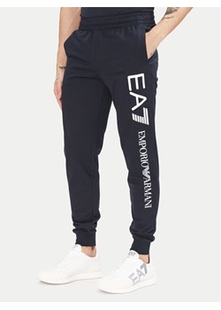 EA7 Emporio Armani Spodnie dresowe 7M000571 AF13512 MB149 Granatowy Regular Fit ze sklepu MODIVO w kategorii Spodnie męskie - zdjęcie 181151219
