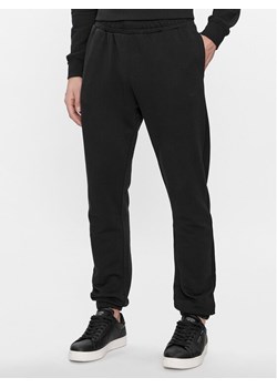 Pepe Jeans Spodnie dresowe Joe Jogger PM211645 Czarny Regular Fit ze sklepu MODIVO w kategorii Spodnie męskie - zdjęcie 181152577
