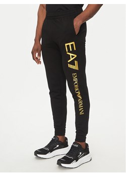 EA7 Emporio Armani Spodnie dresowe 7M000571 AF13512 MC004 Czarny Regular Fit ze sklepu MODIVO w kategorii Spodnie męskie - zdjęcie 181154129