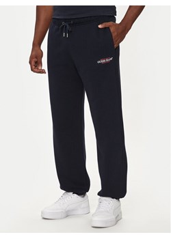 Guess Jeans Spodnie dresowe M4YB18 K9V31 Granatowy Regular Fit ze sklepu MODIVO w kategorii Spodnie męskie - zdjęcie 181158219
