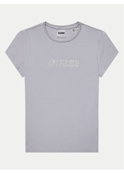 Guess T-Shirt J4RI49 J1314 Fioletowy Regular Fit ze sklepu MODIVO w kategorii Bluzki dziewczęce - zdjęcie 181158557