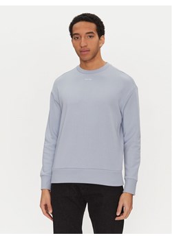 Calvin Klein Bluza Nano Logo K10K112870 Niebieski Regular Fit ze sklepu MODIVO w kategorii Bluzy męskie - zdjęcie 181159167