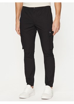 Calvin Klein Jeans Joggery J30J327614 Czarny Skinny Fit ze sklepu MODIVO w kategorii Spodnie męskie - zdjęcie 181161847