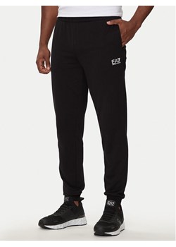 EA7 Emporio Armani Spodnie dresowe 8NPP66 PJVRZ 1200 Czarny Regular Fit ze sklepu MODIVO w kategorii Spodnie męskie - zdjęcie 181163899