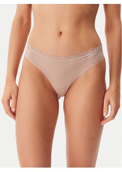 Calvin Klein Underwear Stringi LV00QD5270 Beżowy ze sklepu MODIVO w kategorii Majtki damskie - zdjęcie 181165356