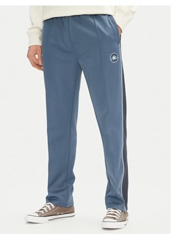 Converse Spodnie dresowe Retro Track 10027328-A01 Niebieski Regular Fit ze sklepu MODIVO w kategorii Spodnie męskie - zdjęcie 181168578