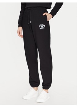 Guess Spodnie dresowe W5RB63 K68I4 Czarny Regular Fit ze sklepu MODIVO w kategorii Spodnie damskie - zdjęcie 181171829