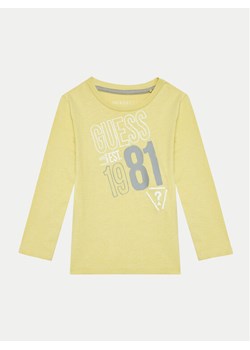 Guess Bluzka N4BI18 I3Z14 Żółty Regular Fit ze sklepu MODIVO w kategorii Bluzki dziewczęce - zdjęcie 181176796
