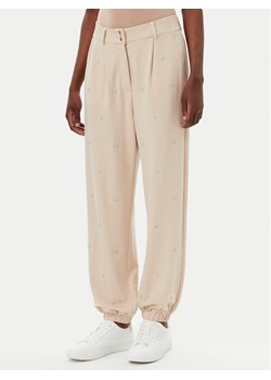 Liu Jo Sport Spodnie dresowe TA5193 J5942 Beżowy Relaxed Fit ze sklepu MODIVO w kategorii Spodnie damskie - zdjęcie 181176809