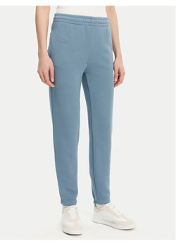 Lacoste Spodnie dresowe XF0353 Niebieski Regular Fit ze sklepu MODIVO w kategorii Spodnie damskie - zdjęcie 181177826