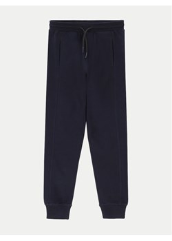 Coccodrillo Spodnie dresowe ZC4120104VBA Granatowy Slim Fit ze sklepu MODIVO w kategorii Spodnie chłopięce - zdjęcie 181180597