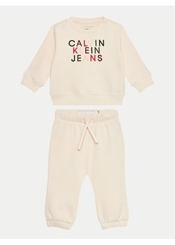 Calvin Klein Jeans Bluza City Logo IN0IN00224 Beżowy Regular Fit ze sklepu MODIVO w kategorii Komplety niemowlęce - zdjęcie 181183515