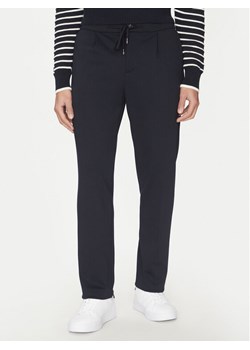 Tommy Hilfiger Spodnie materiałowe Punto MW0MW39197 Granatowy Regular Fit ze sklepu MODIVO w kategorii Spodnie męskie - zdjęcie 181184557